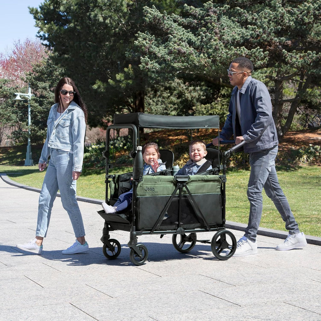 Delta Children - Jeep Wrangler Deluxe 4 Seater Stroller Wagon - Premium Quad Stroller Wagon for 4 Kids with Convertible Seats, Adjustable Push/Pull Handles, Removable Canopy & Flat Fold, Black/Green