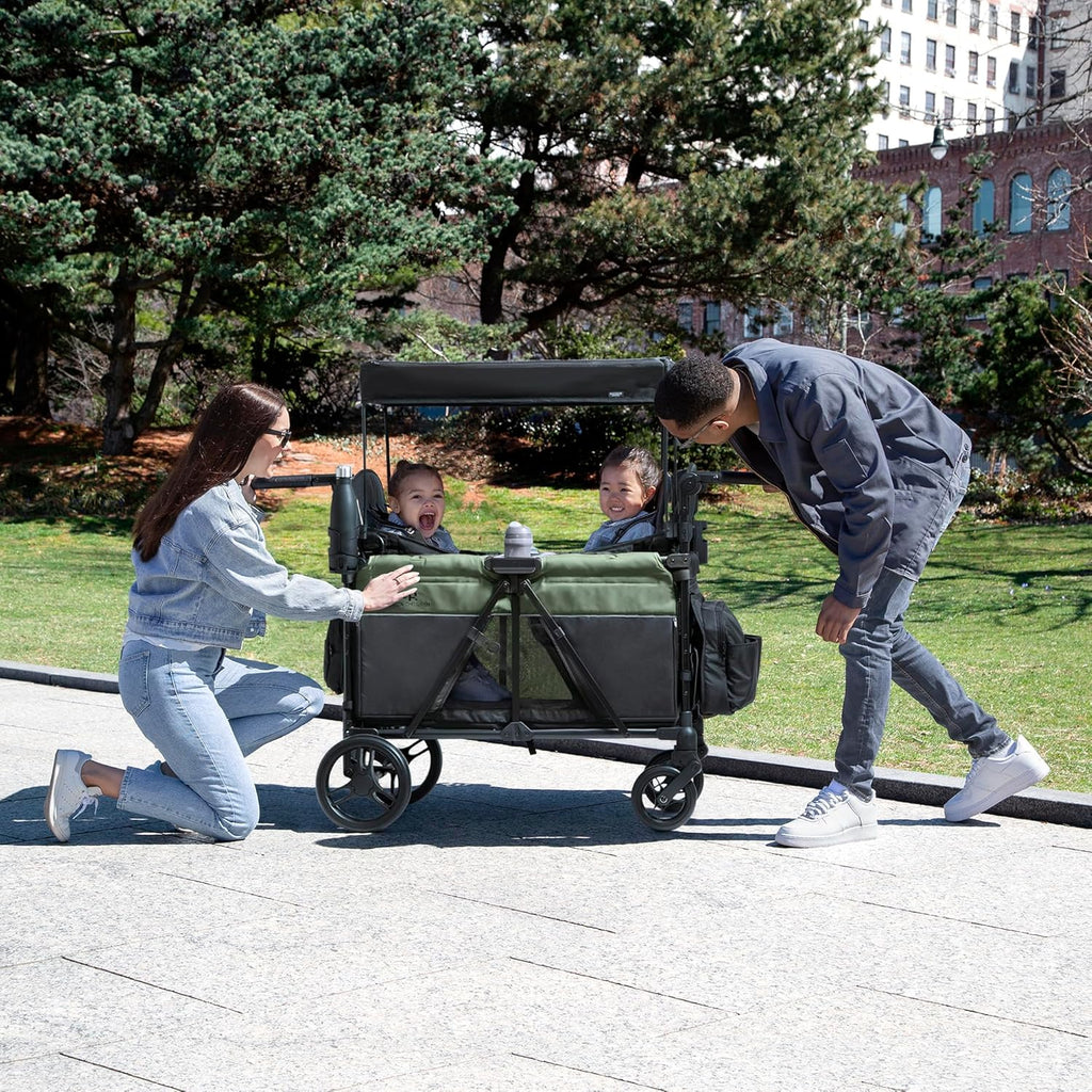 Delta Children - Jeep Wrangler Deluxe 4 Seater Stroller Wagon - Premium Quad Stroller Wagon for 4 Kids with Convertible Seats, Adjustable Push/Pull Handles, Removable Canopy & Flat Fold, Black/Green